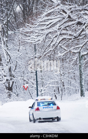 USA, New York City, police car on snowy road Stock Photo