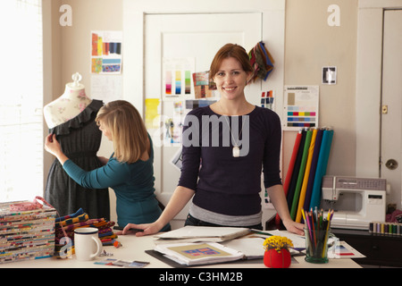 Pair of female fashion designers working in studio Stock Photo