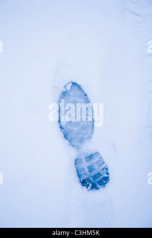 Close-up view of footprint in snow Stock Photo