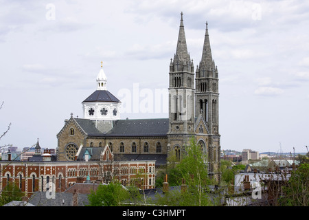 Basilica of Our Lady of Perpetual Help in the Mission Hill section of Boston, Massachusetts as seen from Puddingstone Park. Stock Photo