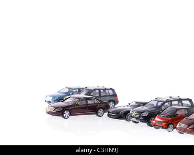Different parked cars on white background Stock Photo