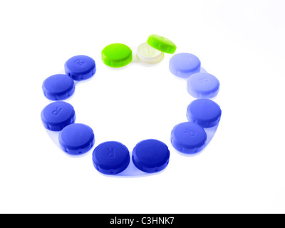 Blue and green contact lens cases on white background Stock Photo