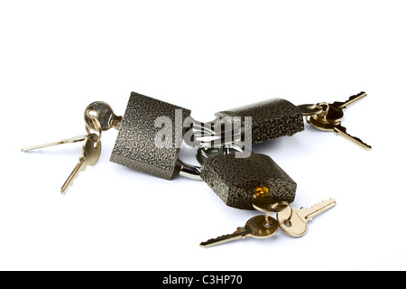 Three hinged locks with keys isolated on a white background Stock Photo