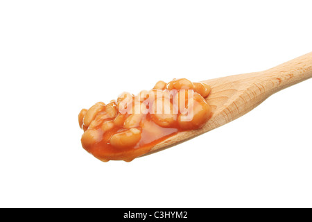 Baked beans in a wooden spoon isolated against white Stock Photo