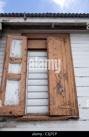 Peeling window shutters in Antigua Stock Photo