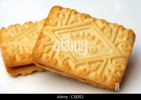 custard cream biscuits on a white plate Stock Photo