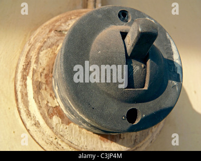 Close up of Old electrical wall switch in off position Stock Photo