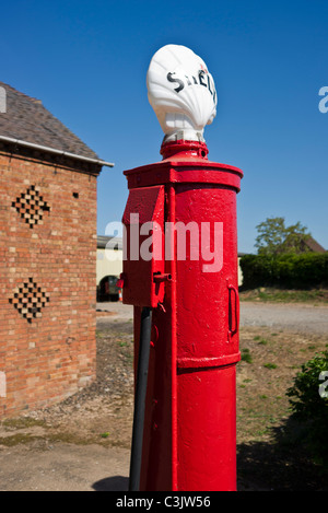 Old fashioned red Shell petrol pump Stock Photo