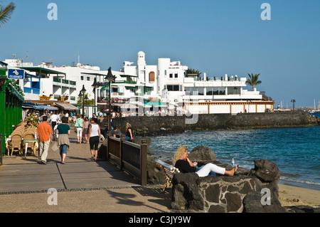 dh promenade PLAYA BLANCA LANZAROTE Tourist walking promenade village ...