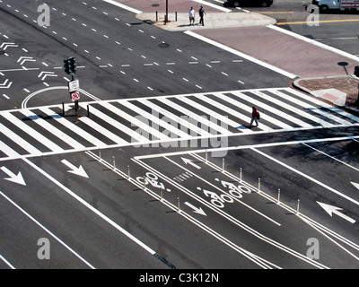 Traffic direction lanes and a pedestrian crosswalk on Constitution Avenue in Washington, D.C. Stock Photo