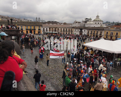 In Quito Ecuador folkloric and traditional dance groups parade through the Plaza San Francisco at Mardi Gras Carnival in March Stock Photo