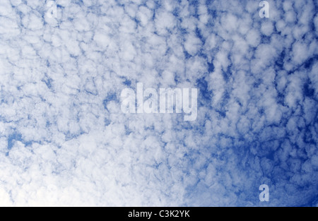 Mackerel sky; Cirrocumulus clouds at a blue sky over Atlantic Coast near Etretat; Cirro Cumulus; fluffy clouds, fleecy clouds Stock Photo