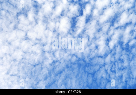 Mackerel sky; Cirrocumulus clouds at a blue sky over Atlantic Coast near Etretat; Cirro Cumulus; fluffy clouds, fleecy cloud Stock Photo