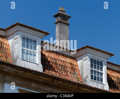 Two roof windows and a chimney Stock Photo