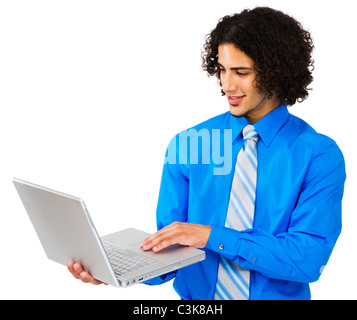 Man using a laptop and smiling isolated over white Stock Photo