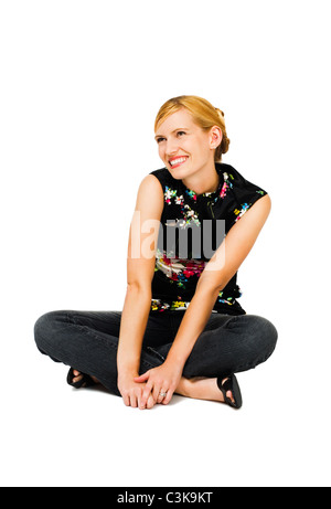 Confident young woman day dreaming and smiling isolated over white Stock Photo