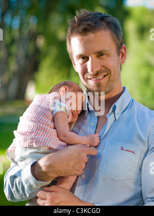 Father holding his newborn daughter Stock Photo