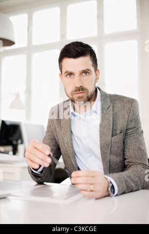 Man working in office Stock Photo