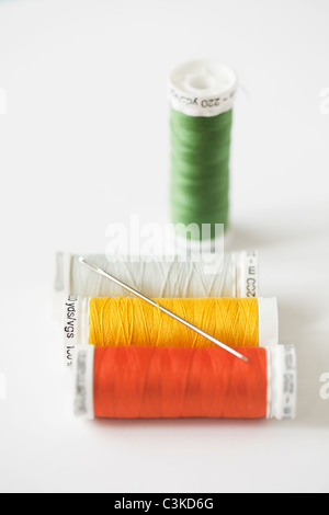 Spools of thread with needle, studio shot Stock Photo