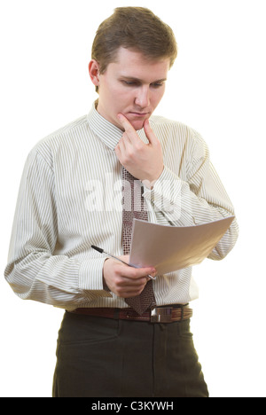 Young businessman is thinking about contract details Stock Photo