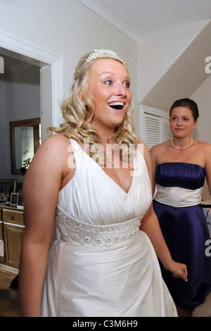 A bride is excited on the morning of her wedding day Stock Photo