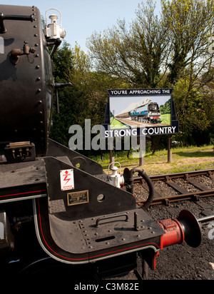 Former LMS Black 5 - no 45379 at Alton Railway Station, Alton, Hampshire, England, UK; with historic advert in background. Stock Photo