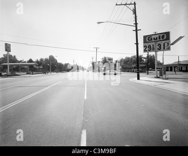 Los Angeles 1960s Negative, Riverside CA Street Scene, Gulf Station 31 cent gas price intersection urban city California black a Stock Photo