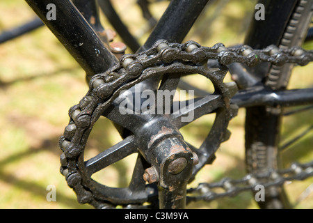 Front sprocket, crank and chain with large links on and early / old Victorian era bicycle / cycle / bike. Stock Photo