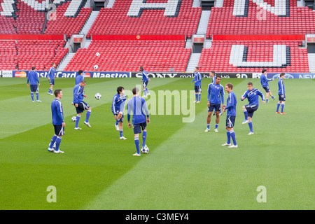 A football team (fc schalke) warming up before a match, Manchester, England Stock Photo