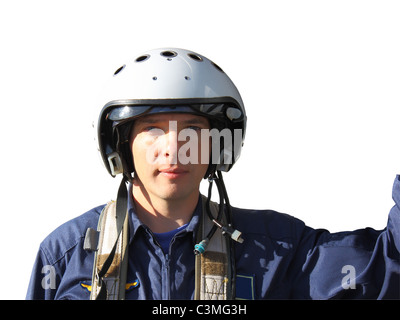 The military pilot in a helmet in dark blue overalls separately on a white background Stock Photo