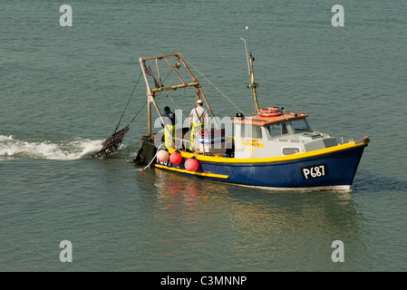 fishing boat trawler two fisherman Portsmouth Harbour UK Stock Photo