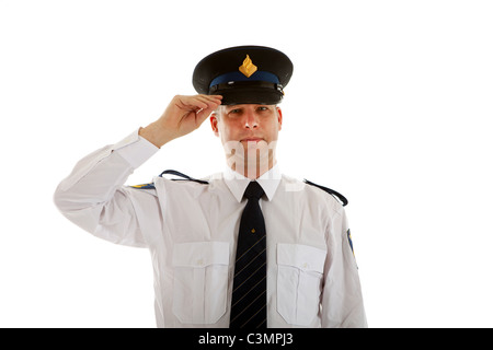 Police officer with hand on cap over white background Stock Photo