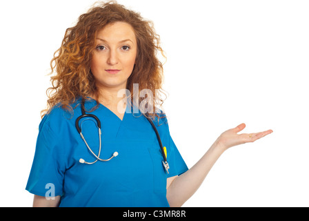 Doctor woman in blue uniform making presentation to copy space isolated on white background Stock Photo