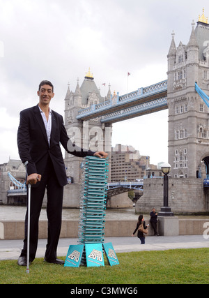 Sultan Kosen, the worlds tallest man, attends a photocall to launch the 2010 edition of Guinness World Records at Potters Field Stock Photo