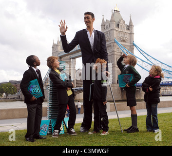 Sultan Kosen, the worlds tallest man, attends a photocall to launch the 2010 edition of Guinness World Records at Potters Field Stock Photo