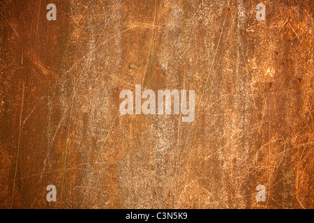 Photography shows a rusty metal background with scrachted surface. Stock Photo