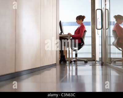 Business Woman in Office on Computer Stock Photo
