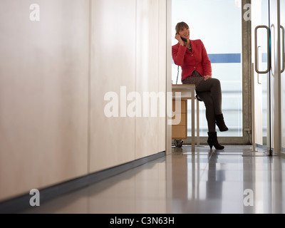 Business Woman in Office on the Phone Stock Photo