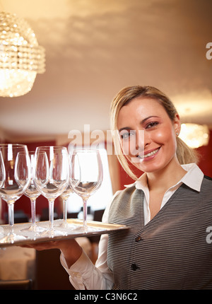 Waitress in restaurant Stock Photo