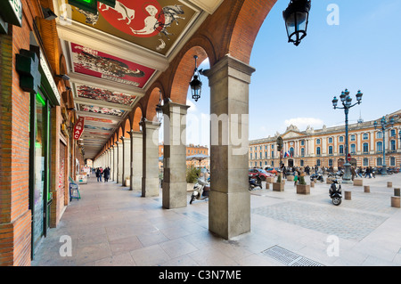 Shops on an arcade in the Place du Capitole in the city centre, Toulouse, Languedoc, France Stock Photo