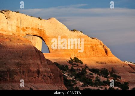 South of Moab, a hot day's last sunlight shines on Utah's Wilson Arch. Stock Photo