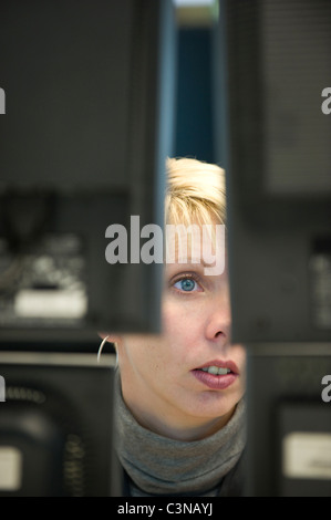 An equity trader at the screen of her computer, Frankfurt am Main, Germany Stock Photo