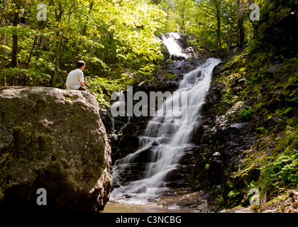 Overall Run waterfall is the highest waterfall in Virginia if its sections are taken into account. Hiker overlooking the falls Stock Photo