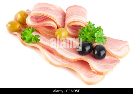 Tasty sliced pork bacon with parsley and black and green olives isolated on white background Stock Photo