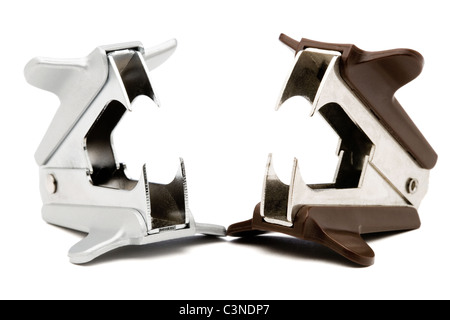 Brown and silver color staple removers isolated over white Stock Photo