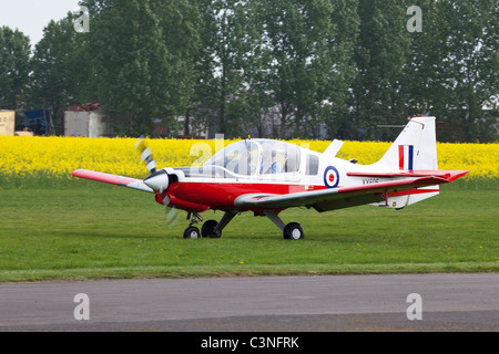 Scottish Aviation Bulldog T1 Series 120 Model 121 XX695 G-CBBT taxiing along ruwnay after landing at Breighton Airfield Stock Photo