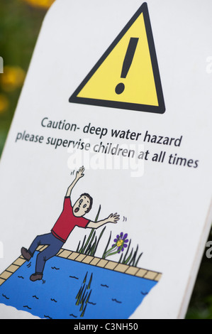 Deep water hazard sign. Garden pond danger sign. UK Stock Photo
