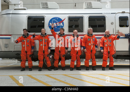 Space shuttle Endeavour's astronauts in orange flight suits with Commander Mark Kelly (R). Stock Photo