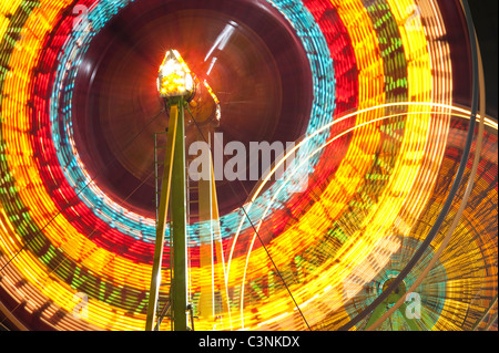 Ferris wheel in motion close up of light streaks Evergreen State Fair Monroe Washington State USA Stock Photo