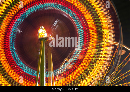 Ferris wheel in motion close up of light streaks Evergreen State Fair Monroe Washington State USA Stock Photo